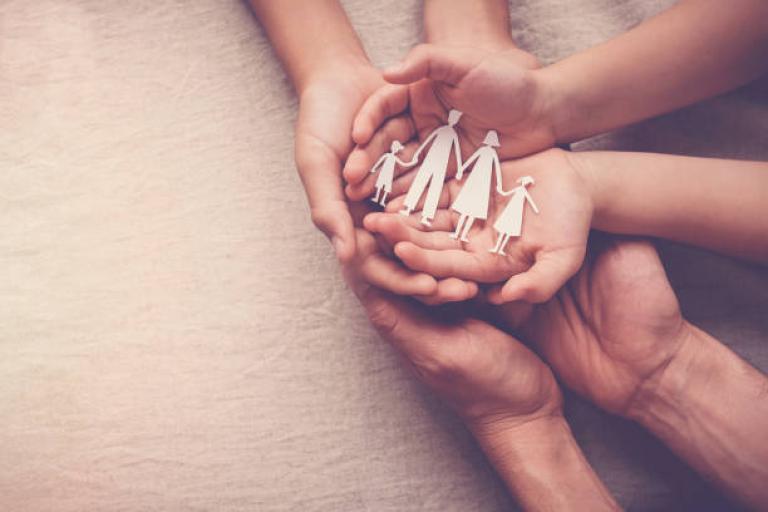 FAMILY HANDS WITH PAPER CUTOUTS