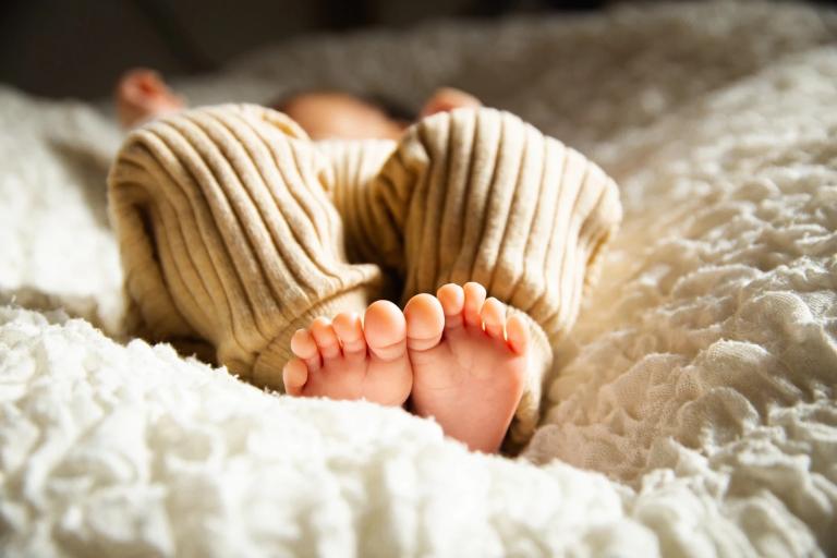 baby laying down in a crib