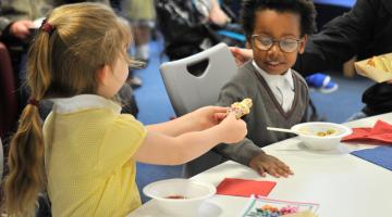 primary school children sharing lunch