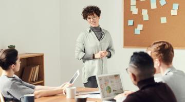 Woman Wearing Gray Cardigan and Eyeglasses